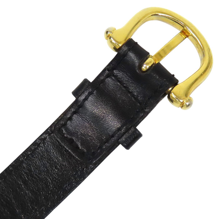 CELINE  
Logo vintage gold-colored hardware  
Macadam leather belt