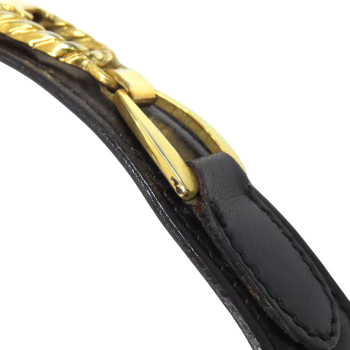 CELINE  
Logo vintage gold-colored hardware  
Macadam leather belt