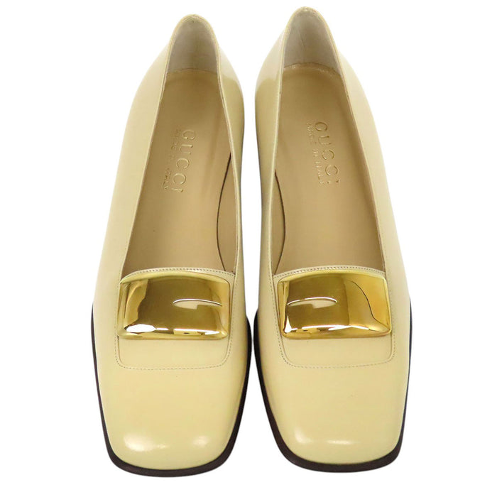 GUCCI 
Leather gold-colored metal square toe 
G logo patent pumps