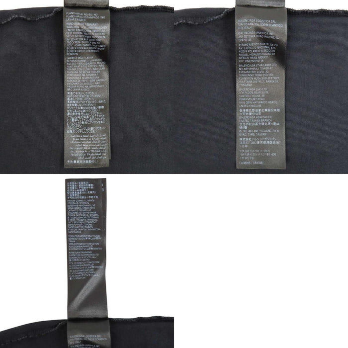 BALENCIAGA  
T-shirt oversize in cotone con effetto sbiadito e strappi, logo a nastro
