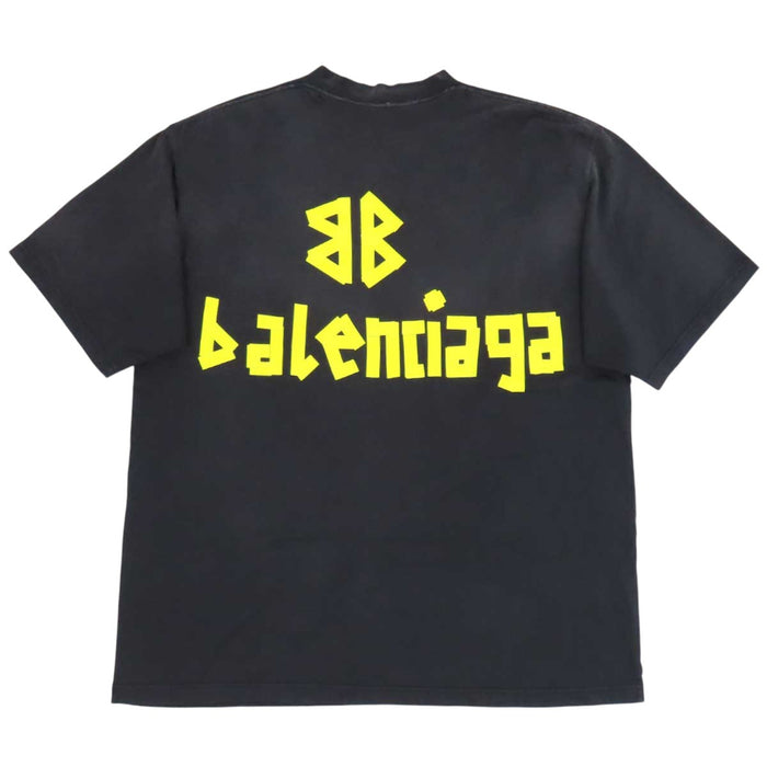 BALENCIAGA  
T-shirt oversize in cotone con effetto sbiadito e strappi, logo a nastro