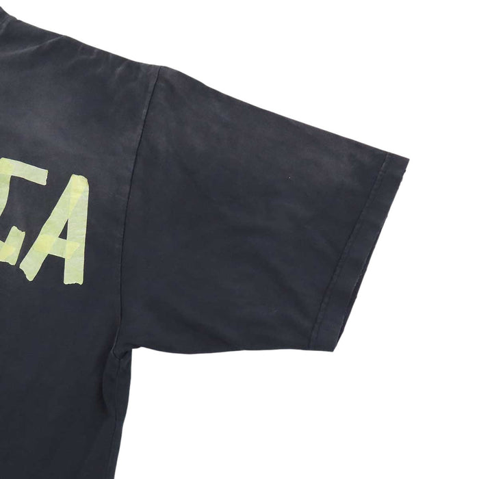 BALENCIAGA  
T-shirt oversize in cotone con effetto sbiadito e strappi, logo a nastro
