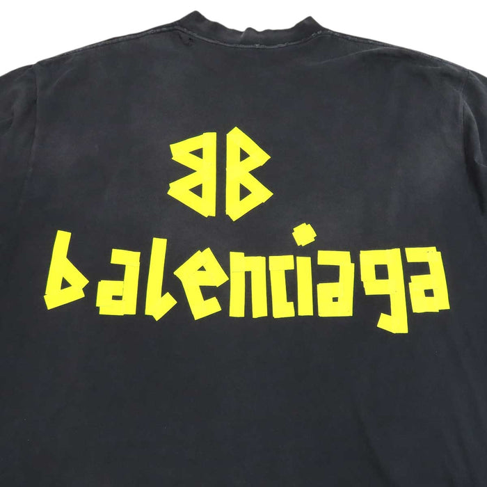 BALENCIAGA  
T-shirt oversize in cotone con effetto sbiadito e strappi, logo a nastro
