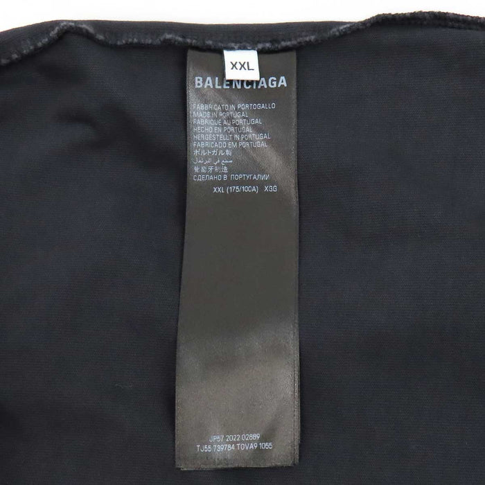 BALENCIAGA  
T-shirt oversize in cotone con effetto sbiadito e strappi, logo a nastro