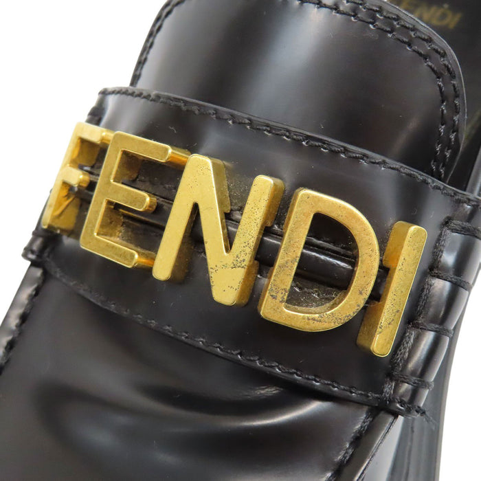 FENDI  
Logo leather gold-colored metal  
Graffiti loafers