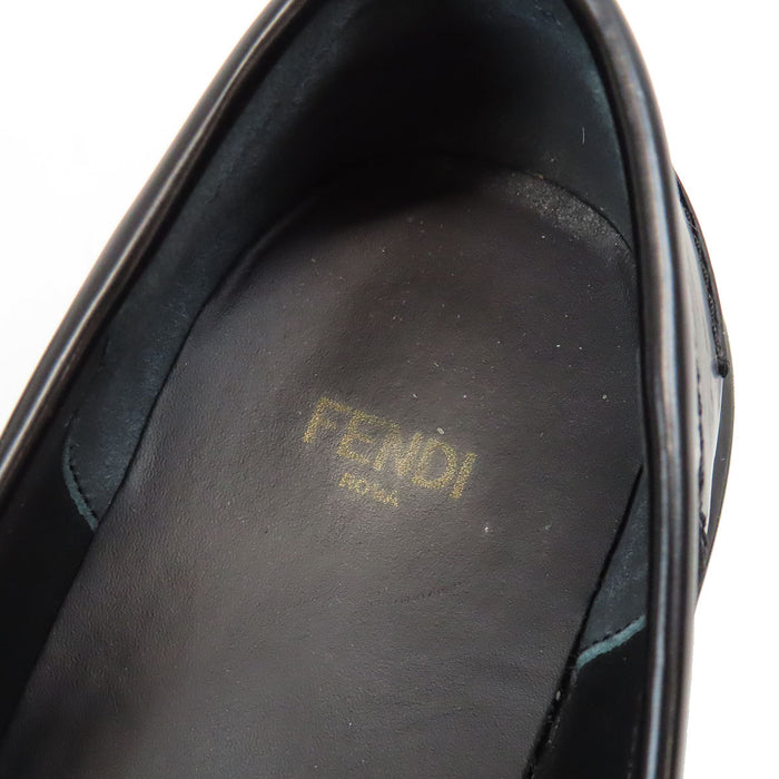 FENDI
Mocassini grafici in pelle con logo e metallo color oro