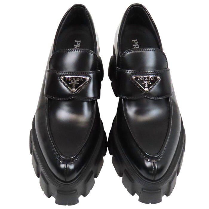 PRADA  
Triangle Logo Pointed Toe  
Monolith Brushed Leather Loafers