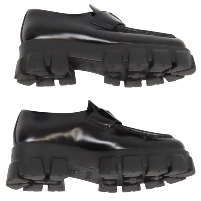 PRADA  
Triangle Logo Pointed Toe  
Monolith Brushed Leather Loafers