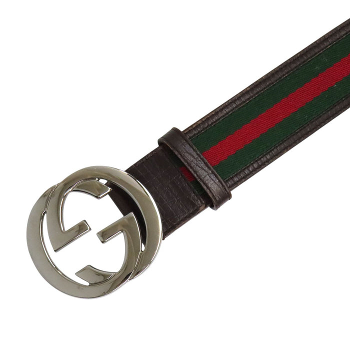 GUCCI  
GG leather web stripe with silver-colored hardware  
Interlocking G Shelly line belt