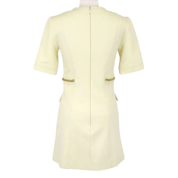GUCCI  
Chain button with gold-colored hardware  
Double G short-sleeve dress
