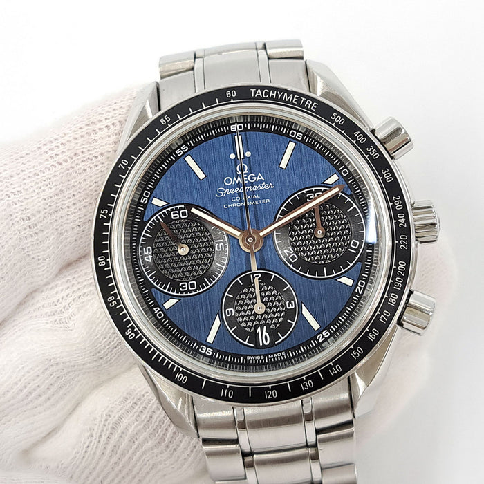 OMEGA 
Speedmaster Racing 
Avec boîte et carte de garantie