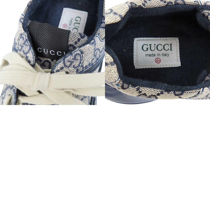 GUCCI 
All-over logo low-top lace-up 
GG Rhyton sneakers