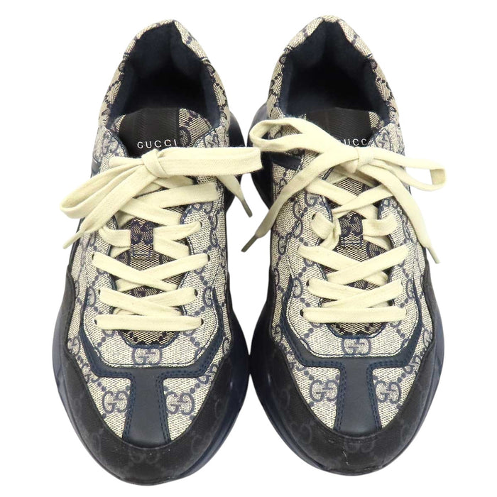 GUCCI 
All-over logo low-top lace-up 
GG Rhyton sneakers