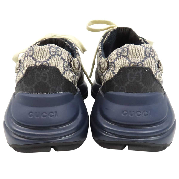 GUCCI 
All-over logo low-top lace-up 
GG Rhyton sneakers