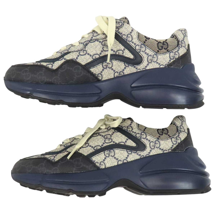 GUCCI 
All-over logo low-top lace-up 
GG Rhyton sneakers