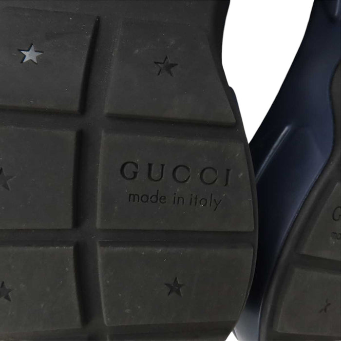 GUCCI 
All-over logo low-top lace-up 
GG Rhyton sneakers