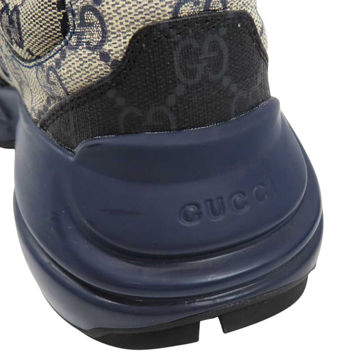 GUCCI 
All-over logo low-top lace-up 
GG Rhyton sneakers