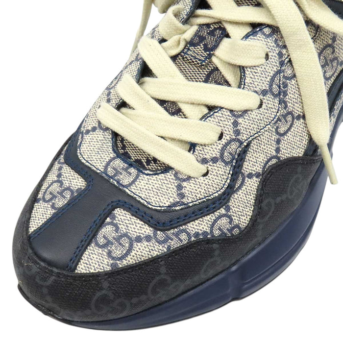 GUCCI 
All-over logo low-top lace-up 
GG Rhyton sneakers