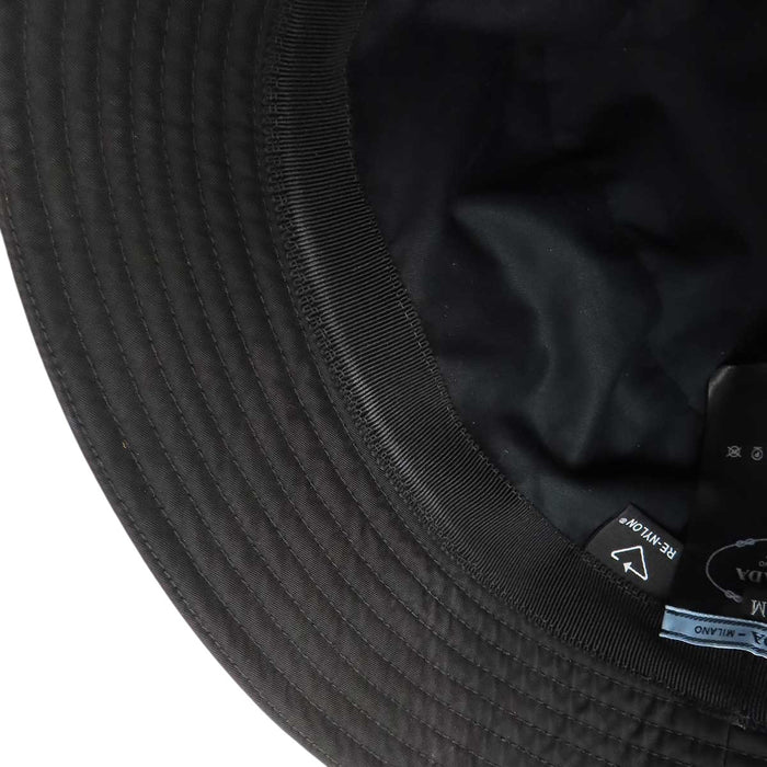 PRADA 
Triangle Logo Re-Nylon 
Re-Nylon Bucket Hat