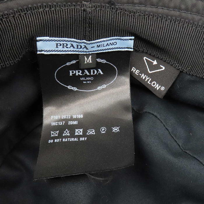 PRADA 
Triangle Logo Re-Nylon 
Re-Nylon Bucket Hat