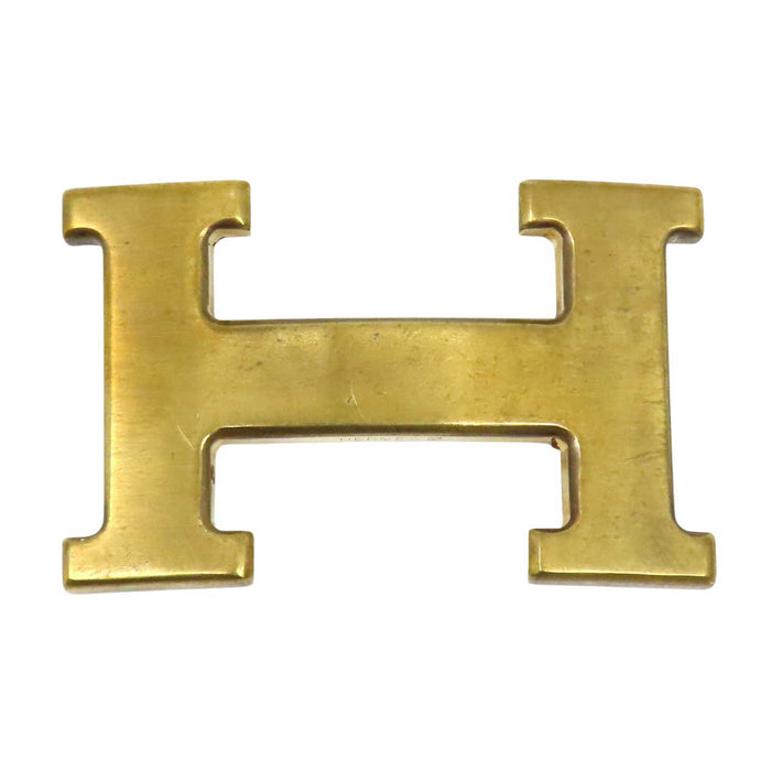 HERMES 
Ash Logo Gold-Tone Metal 
H Buckle