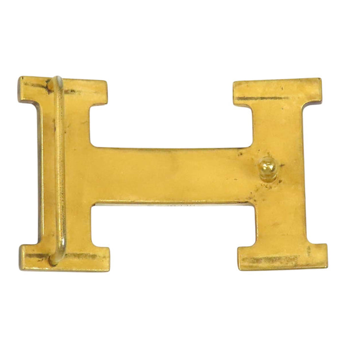 HERMES 
Ash Logo Gold-Tone Metal 
H Buckle
