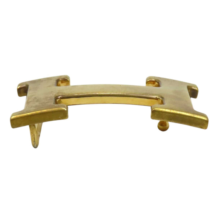 HERMES 
Ash Logo Gold-Tone Metal 
H Buckle