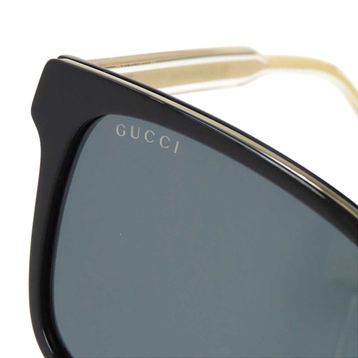 GUCCI 
Eyewear Wellington Clear 
Logo Temple Sunglasses
