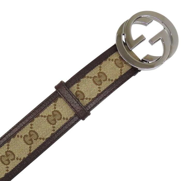 GUCCI 
Logo silver-tone metal 
Interlocking G buckle GG canvas leather belt