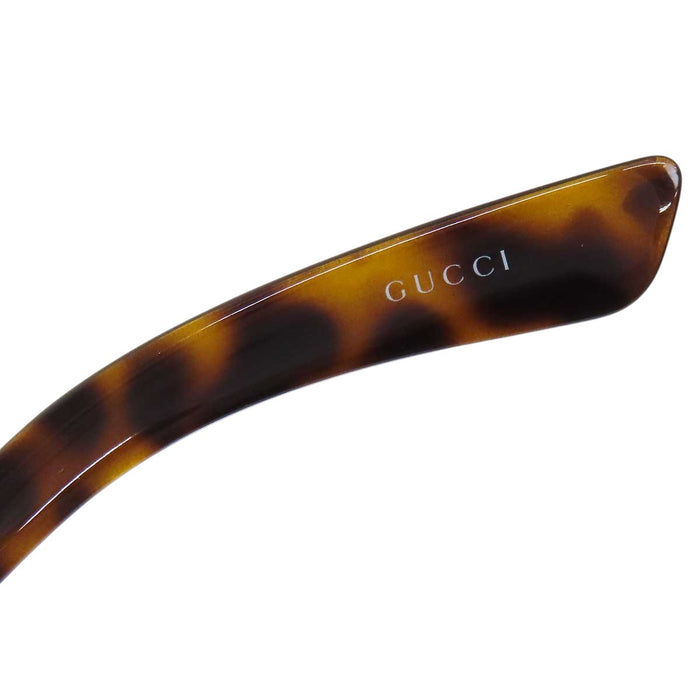 GUCCI 
Eyewear logo gold-tone metal 
Interlocking G sunglasses