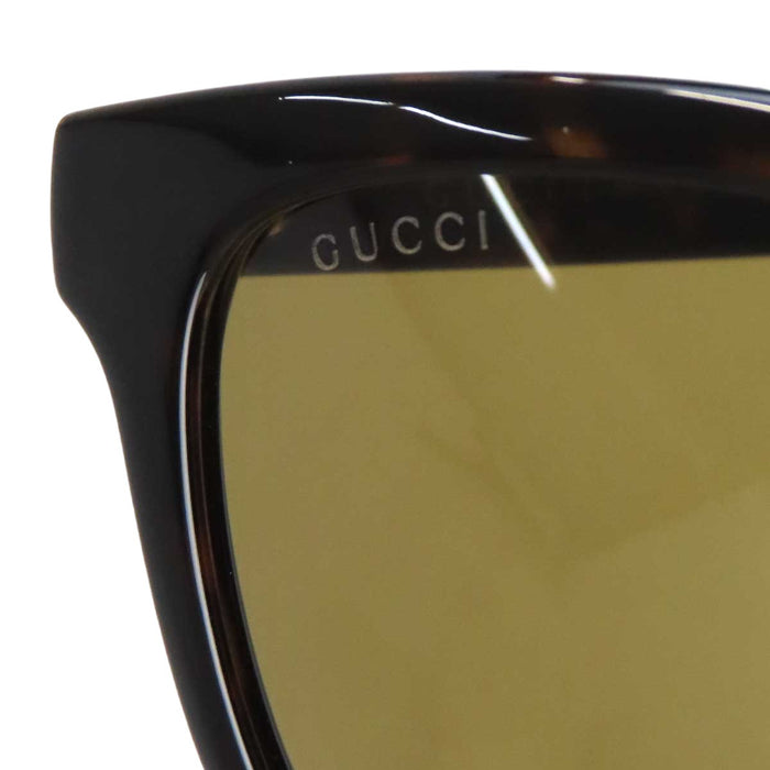GUCCI 
Eyewear logo 
Interlocking G web stripe sunglasses