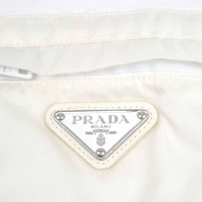 PRADA 
Cotton Re-Nylon Contrast Panel 
Triangle Logo Cotton Nylon T-Shirt