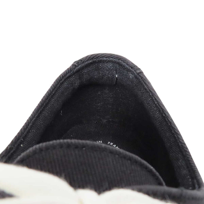 CHANEL 
COCO CC Logo Embroidered Lace-Up 
Coco Mark Canvas Sneakers