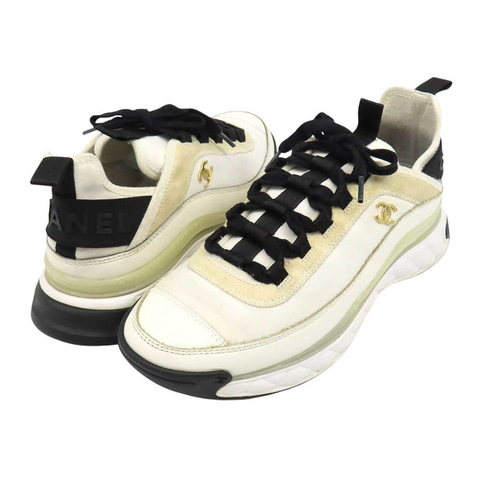 CHANEL 
COCO CC logo gold-tone metal lace-up 
Coco Mark leather fabric sneakers