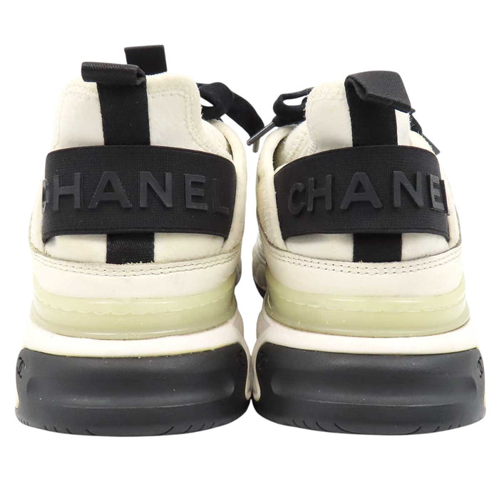 CHANEL 
COCO CC logo gold-tone metal lace-up 
Coco Mark leather fabric sneakers