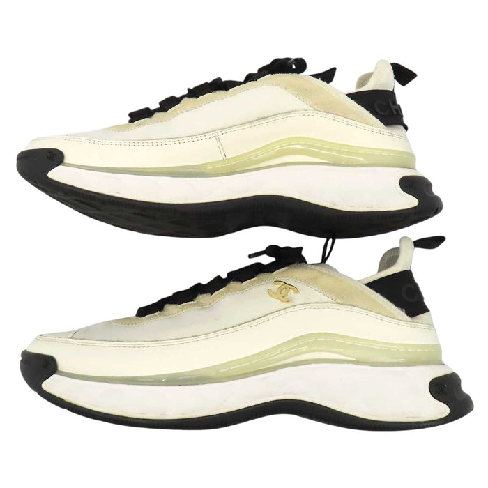 CHANEL 
COCO CC logo gold-tone metal lace-up 
Coco Mark leather fabric sneakers