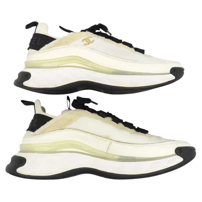 CHANEL 
COCO CC logo gold-tone metal lace-up 
Coco Mark leather fabric sneakers