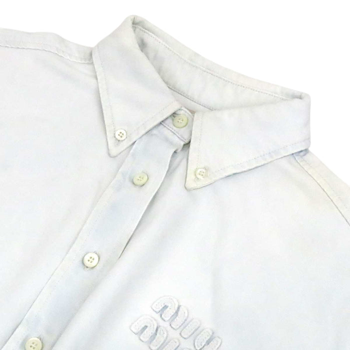 MIUMIU 
Logo raw-edge cotton long-sleeve 
Cropped denim shirt