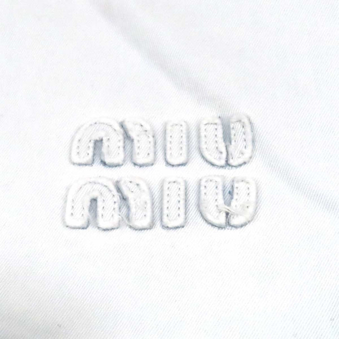 MIUMIU 
Logo raw-edge cotton long-sleeve 
Cropped denim shirt