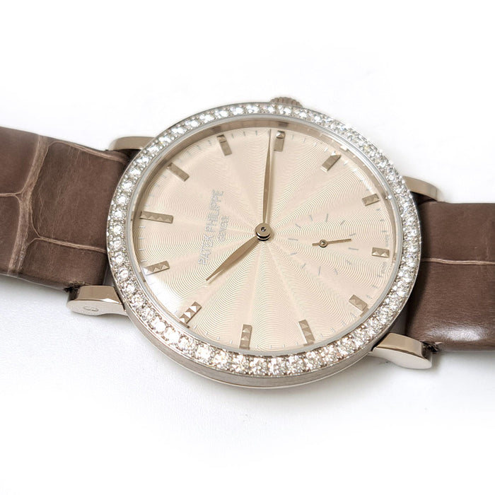 PATEK PHILIPPE 
Calatrava with diamond bezel 
With papers