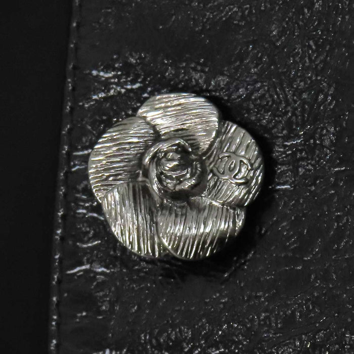 CHANEL 
COCO CC camellia calfskin Coco button 
Coco logo leather coat