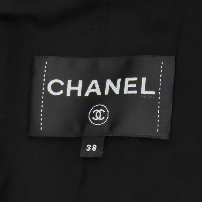 CHANEL 
COCO CC camellia calfskin Coco button 
Coco logo leather coat