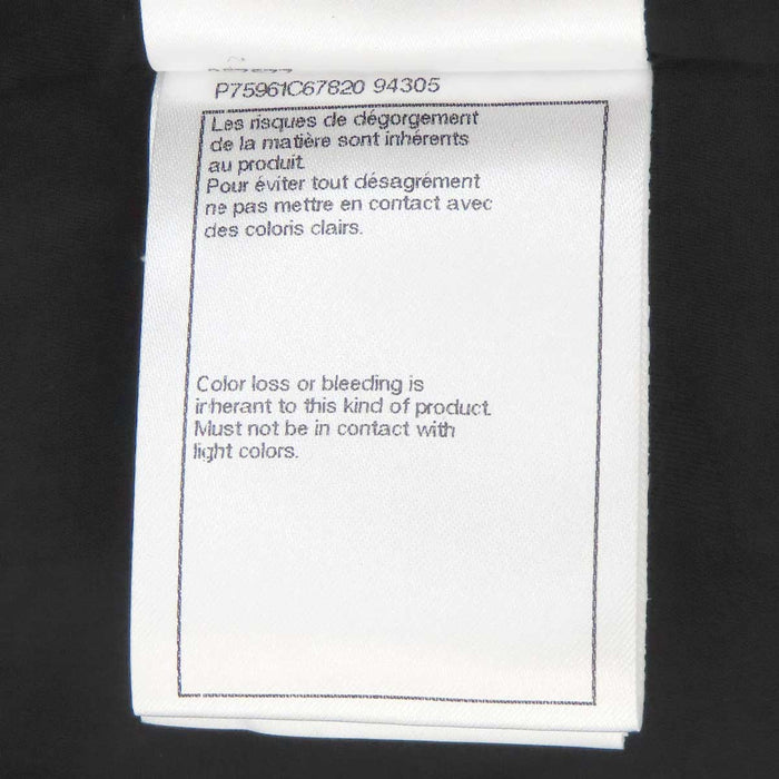 CHANEL 
COCO CC camellia calfskin Coco button 
Coco logo leather coat