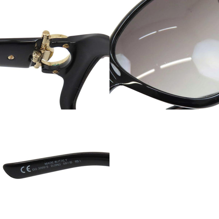 GUCCI 
Logo, métal doré, lentilles dégradées 
Lunettes avec mors de cheval