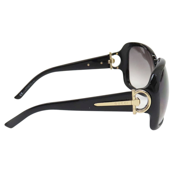 GUCCI 
Logo, métal doré, lentilles dégradées 
Lunettes avec mors de cheval