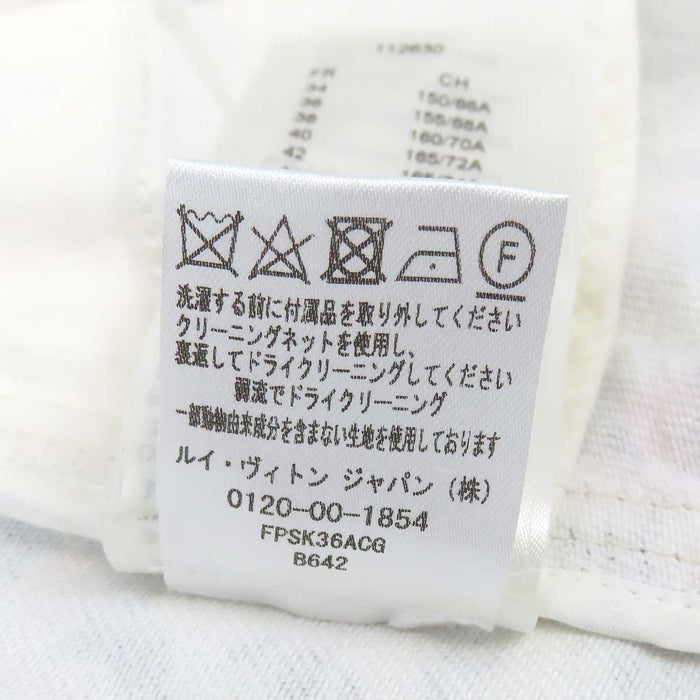 LOUIS VUITTON 
Étiquette de bagage en coton à motif LV intégral 
Minijupe Monogram Flower