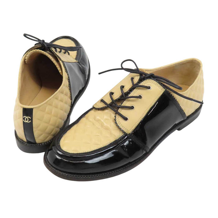 CHANEL 
COCO CC logo leather lace-up 
Coco logo two-tone loafers 
Matelassé