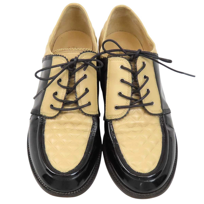CHANEL 
COCO CC logo leather lace-up 
Coco logo two-tone loafers 
Matelassé