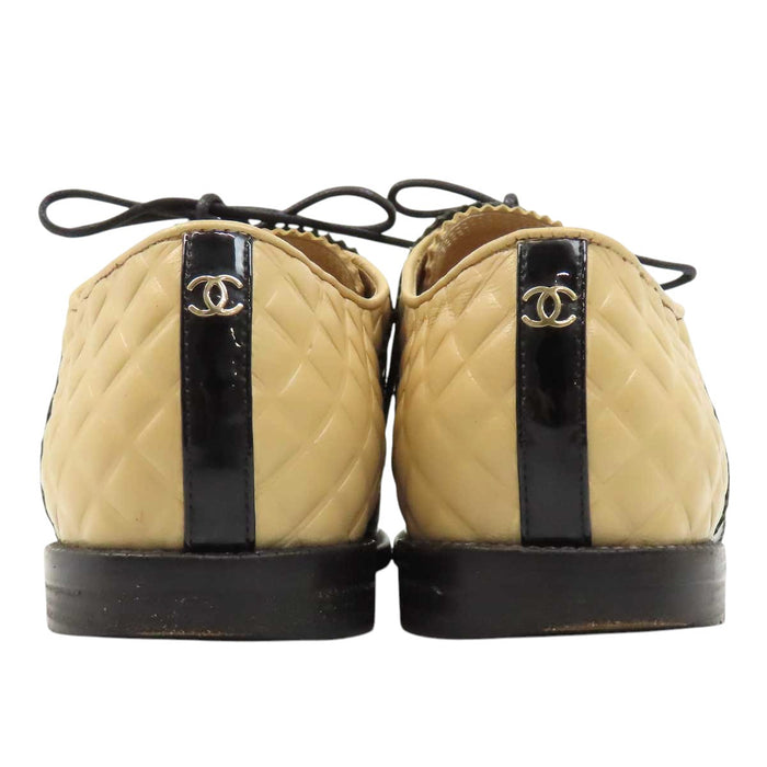 CHANEL 
COCO CC logo leather lace-up 
Coco logo two-tone loafers 
Matelassé