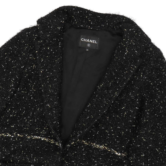 CHANEL 
COCO CC bouton Coco en laine pailletée 
manteau en tweed à motif Coco